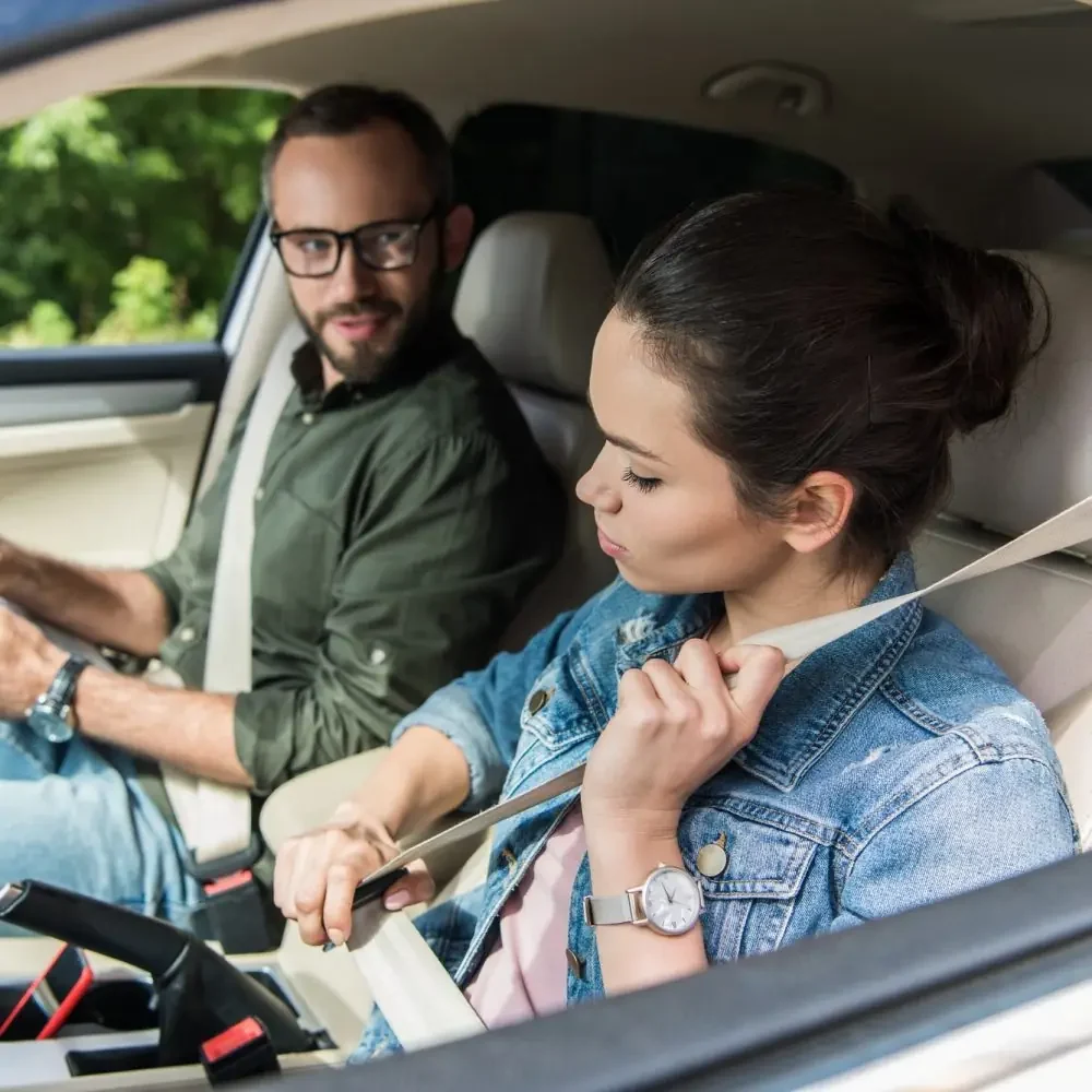 Student fastening seatbelt with a certified instructor beside them before a supervised driving lesson at Canadian Way Driver Training in Halifax